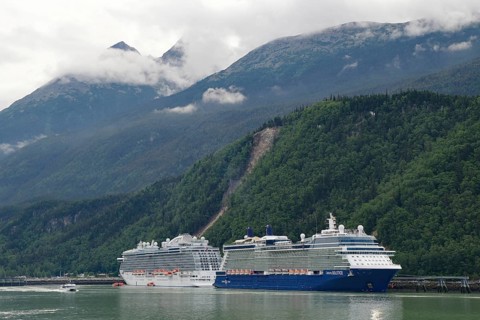 Two large cruise ships in front of high mountains in the harbour of Skagway, Alaska, USA, North