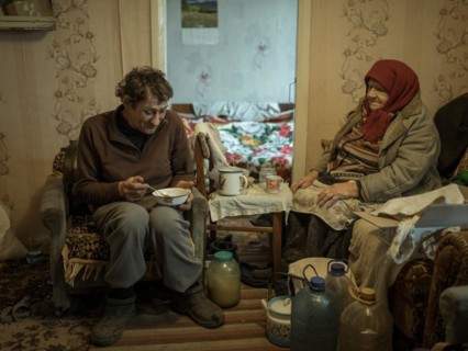 Varvara, 85, and her son Leonid, 56. Leonid looks after his mother, who is in need of care. She