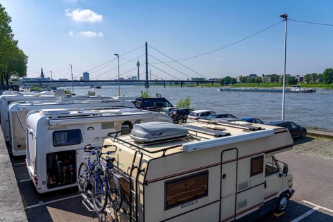Motorhome parking space on the banks of the Rhine, Düsseldorf skyline on the Rhine, Rhine Tower,