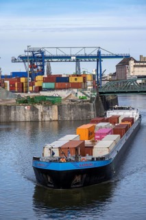 Container freighter Aarburg, leaving the container terminal in Frankfurt Osthafen, belonging to