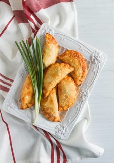 Fried chebureks, close-up, on a light background, no people