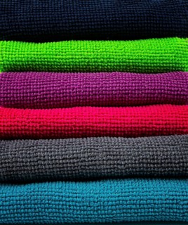 A stack of multicolored, microfiber cloths, for cleaning