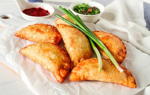 Fried chebureks, close-up, on a light background, no people