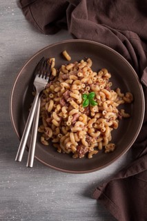 Pasta with stewed meat, pasta in the navy, horns, homemade, no people