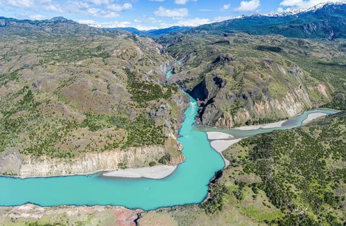 Confluence of river Rio Baker and Rio Chacabuco, aerial view, muddy water of Rio Chacabuco merges