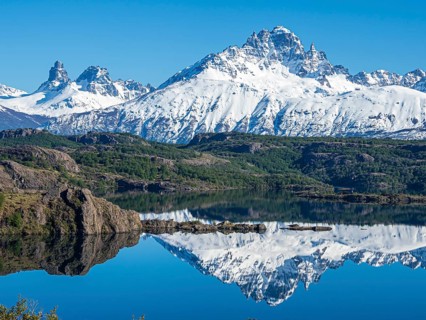 The snow-covered Mt. Cerro Castillo is reflected in a lake, Patagonia, Chile, South America