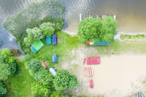 Canoes at a rental station, drone shot, village Granzow near Mirow, Mecklenburg lake district,