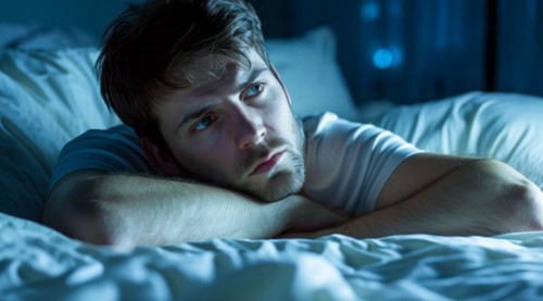 Insomnia of a stressed depressed man lying sleepless in bed. Sleep disorder, AI generated