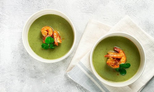 Pea cream soup, with shrimp, green soup, homemade, top view, no people