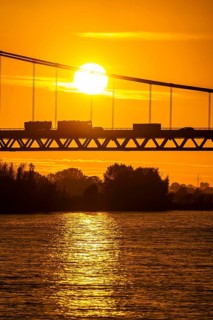 Traffic on the Rhine bridge Emmerich, federal road B220, evening light, with 803 m the longest