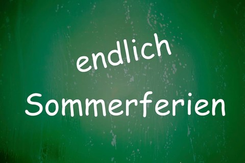 Symbolic image summer holidays: The word ENDLICH SOMMERFERIEN is written on a school blackboard
