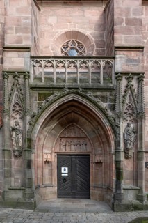 Main entrance portal of St Nicholas and St Ulrich Church, nave built around 1400, Kirchenberg 15,