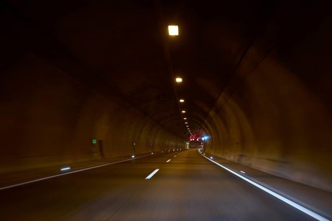 Motorway tunnel A71 with illuminated road and modern light installations offering a perspective