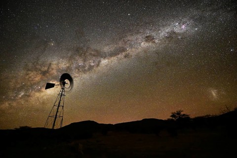 Milky Way over a wind-powered water pump, Namibia, Africa
