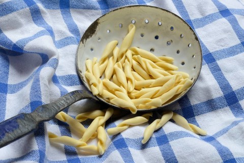 Strozzapreti, uncooked Italian pasta in a sieve, Italy, Europe