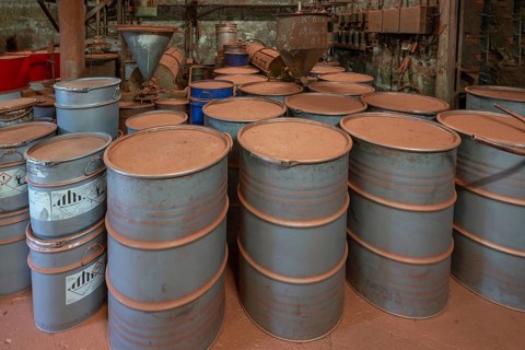 Metal drums for metal powder in the bronze powder filling room of a metal powder mill, founded in