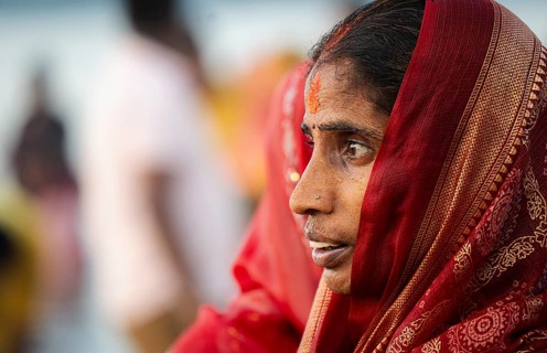 Hindu devotees perform rituals as they offer prayers to the Sun god in the bank of Brahmaputra