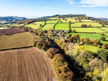 Fields and Farms over River Usk from a drone, Brecon, Brecon Beacons, Powys, Wales, England, United