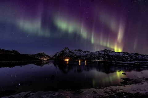 Northern lights over fjord, steep mountains, winter, aurora borealis, Flakstadoya, Lofoten, Norway,