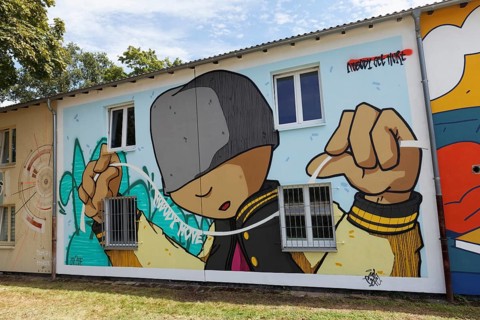 Mural with figure of a boy, Nobody Moves, Nobody gets hurt, by street artist MOH ONE, 40 Grad Urban