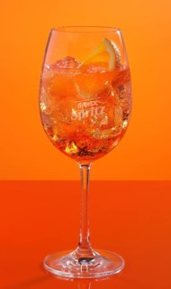 Aperol Spritz in front of an orange background