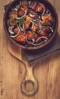 Fried meat, pork kebab, ketsi in a clay pan, with red onions and herbs, homemade, no people