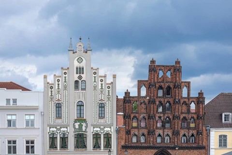 Two house gables from different stylistic periods, Art Nouveau around 1900 and Gothic, Wismar,