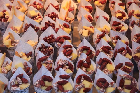 Cheese and small sausages packed for sale, Mercado San Miguel market, Madrid city centre, Spain,