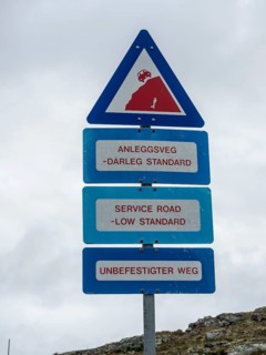Warning sign, bad quality of a service road, side road of Sognefjell mountain pass, Sognefjell,
