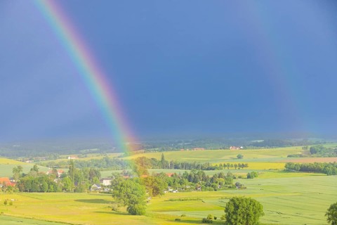Thunderstorm cell with rainbow over fields near Krebs in the Osterzgebirge, Krebs, Saxony, Germany,