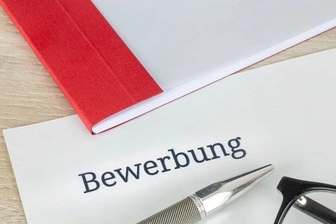 Symbolic image of an application: Close-up of documents for an application