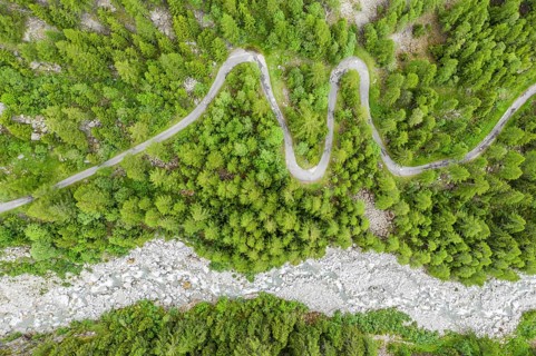 Aerial view, drone shot, windy road along a river, mountain valley, Switzerland, Europe