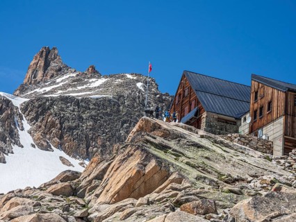 Tourists outside mountain Cabin 'Cabane d'Orny, swiss alps, canton Valais, Switzerland, Europe
