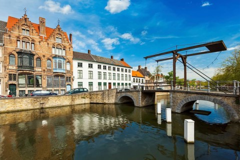 Canal with old bridge and medieval houses. Bruges (Brugge), Belgium, Europe