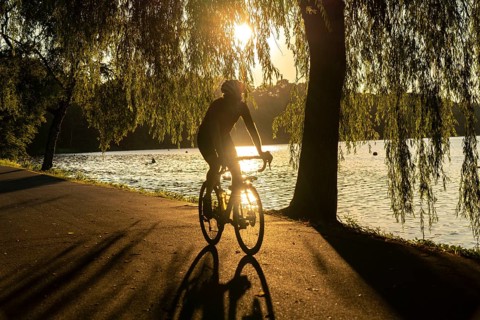 Cycling on Lake Baldeney, around 14 kilometres around the Ruhr reservoir, summer evening on the