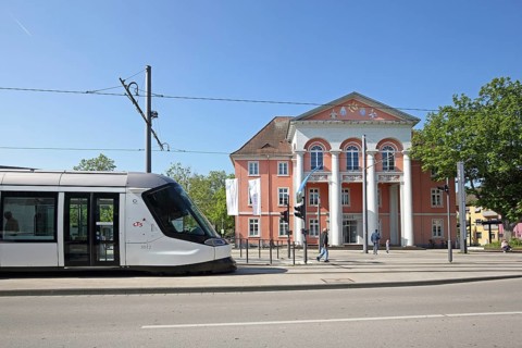 Neoclassicism town hall built in 1910 and tram, tram stop, people, public transport, town hall