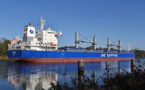 The new cargo ship, Bulk Carrier, JNS OCEAN sails for the first time in the Kiel Canal,