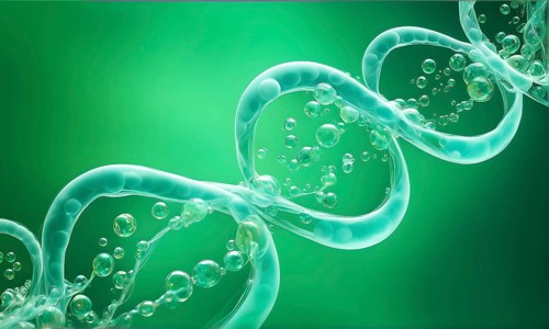 Helix shaped structure bathed in vibrant green color interconnected with a string of iridescent