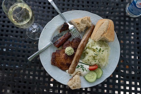Steaks and bratwurst with coleslaw and quark served in a garden pub, Bavaria, Germany, Europe