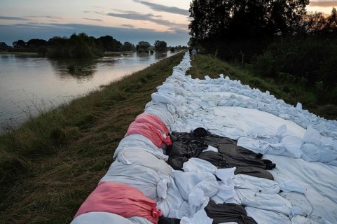 Reinforcement of river embankments with sandbags, flood risk in Poland