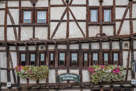 An old half-timbered town in autumn. A church was built into a rock here. Unique German