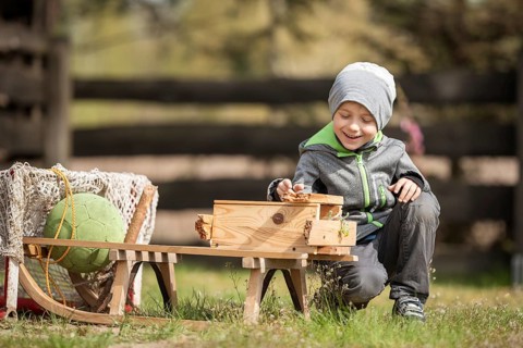 Smiling 6 years old boy playing aoutdoor