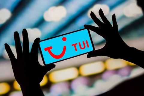 In this photo illustration, the TUI Airways Limited logo is displayed on a smartphone screen