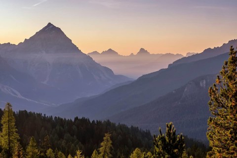 Sunrise over alpine peaks and The Tofane Group in the Dolomites, Italy, Europe
