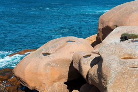 Close-up of jagged rocks with a view of the blue water, Ploumanac'h, Ploumanach, Perros-Guirec,