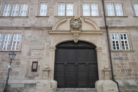 Former prince-bishop's rent office with coat of arms cartouche above the portal, from 1693, today