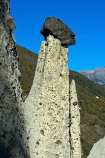 Earth pyramids of Euseigne with cairn, Hérémence, Hérens Valley, Val d'Hérens, Valais, Switzerland,