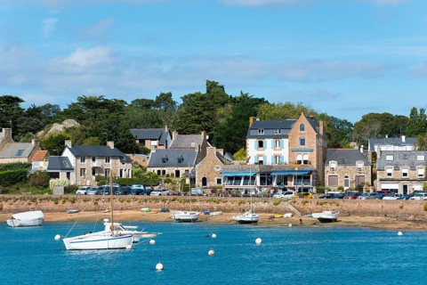 Small town at the harbour with boats on blue water, sunny day, Ploumanac'h, Ploumanach,
