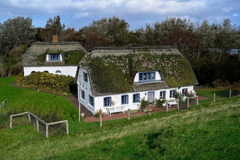 Thatched-roof house on Kaydeich, Pellworm Island, Schleswig-Holstein Wadden Sea National Park,