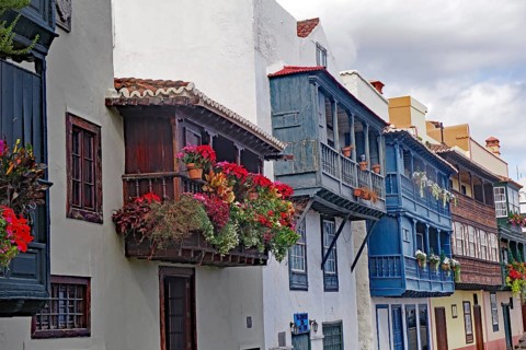 Traditional houses with colourful flowering balconies in a town, Canarian balconies, Santa Cruz de